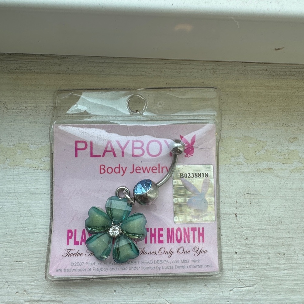 Playboy belly button ring